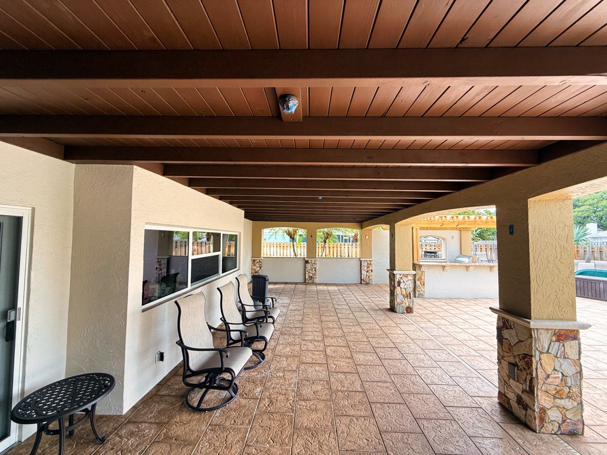 Covered patio and lanai exterior painting project on Desoto Dr in Satellite Beach, FL by Launch Painting Co.