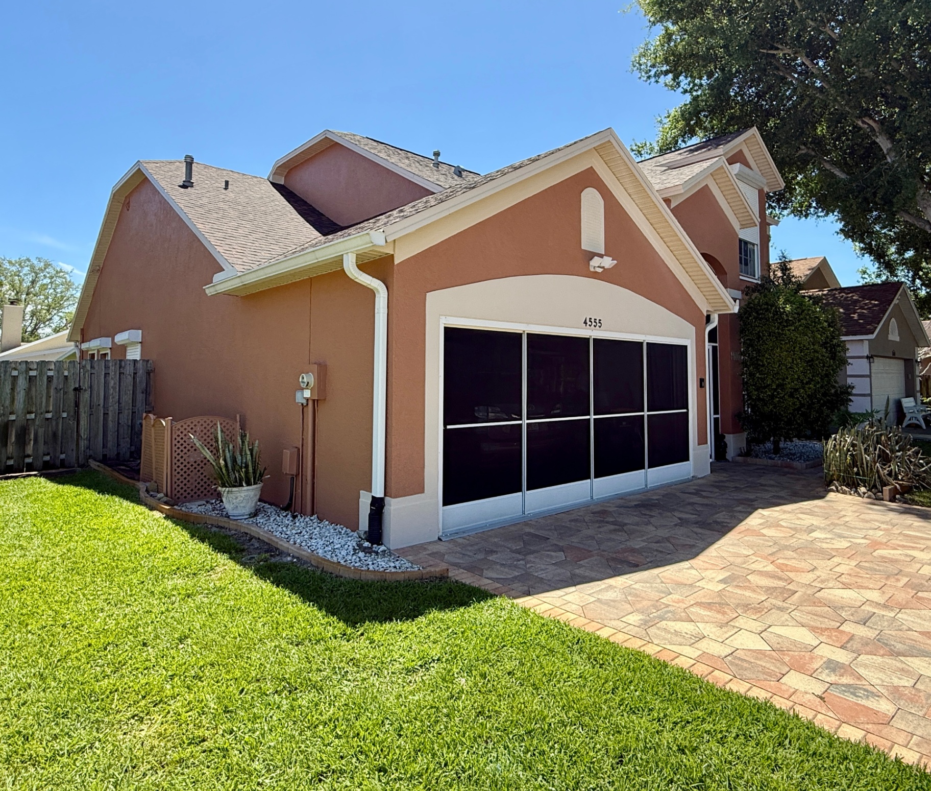 Freshly repainted terracotta stucco exterior of a Melbourne, FL home after exterior painting by Launch Painting Co.
